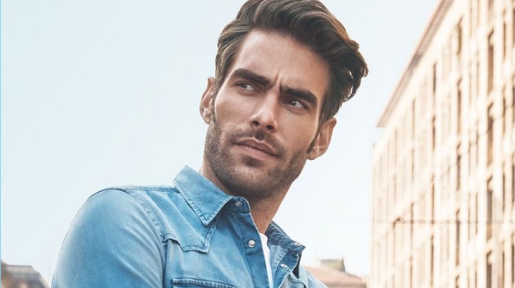 Sporting a denim shirt, Jon Kortajarena appears in Liu Jo Uomo's spring-summer 2018 campaign.