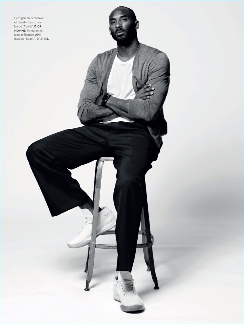 Sporting a cardigan and t-shirt by Dior Homme, Kobe Bryant also wears AMI pants and Kobe A.D. Nike sneakers.