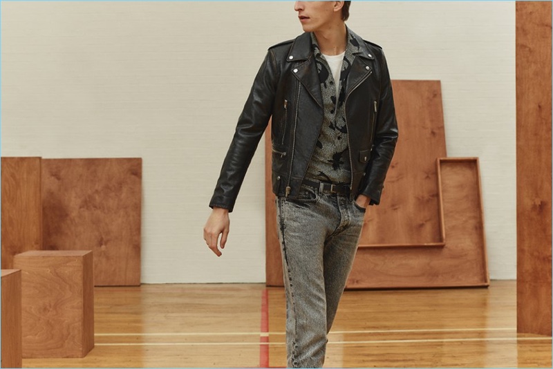 Tap into an easy cool with a leather biker jacket, camp-collar shirt, t-shirt, and acid wash jeans by Saint Laurent.