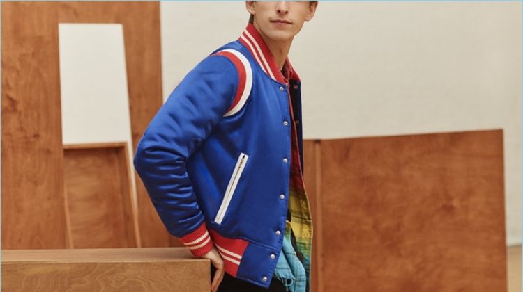A varsity cool thrives with AMIRI's silk-satin bomber jacket, dip-dyed flannel shirt, t-shirt, and denim jeans.