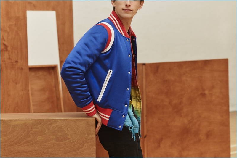 A varsity cool thrives with AMIRI's silk-satin bomber jacket, dip-dyed flannel shirt, t-shirt, and denim jeans.