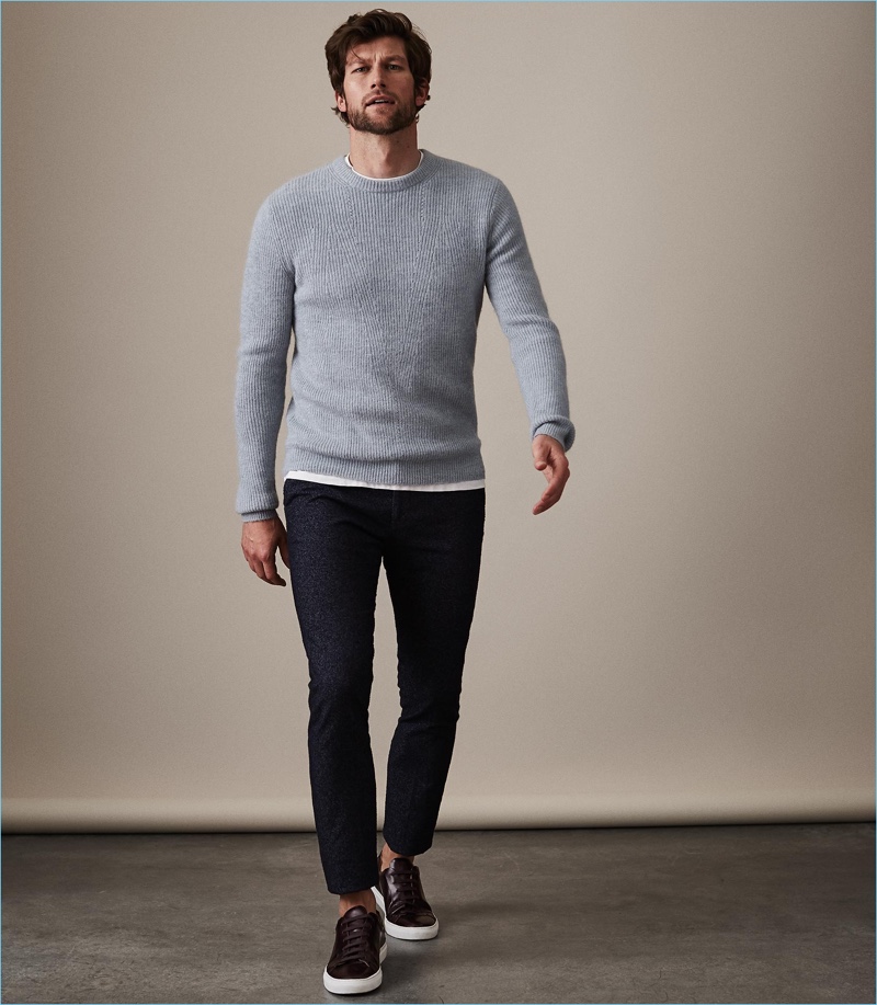 Color: Adding color to your wardrobe doesn't have to be a head-turner. Here, model Jan Trojan wears a soft blue sweater by Reiss.