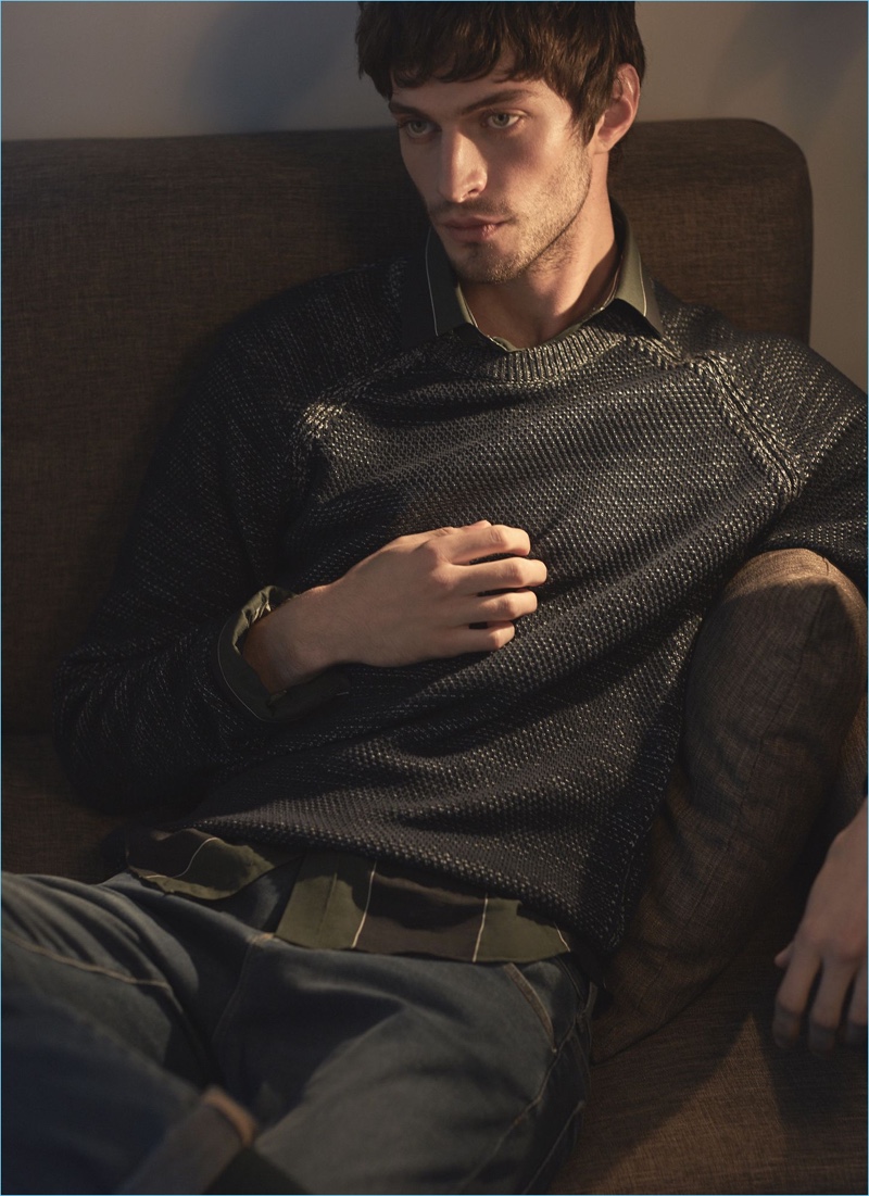 British model Matthew Bell gets comfortable in a Reiss sweater, striped shirt, and slim-fit jeans.