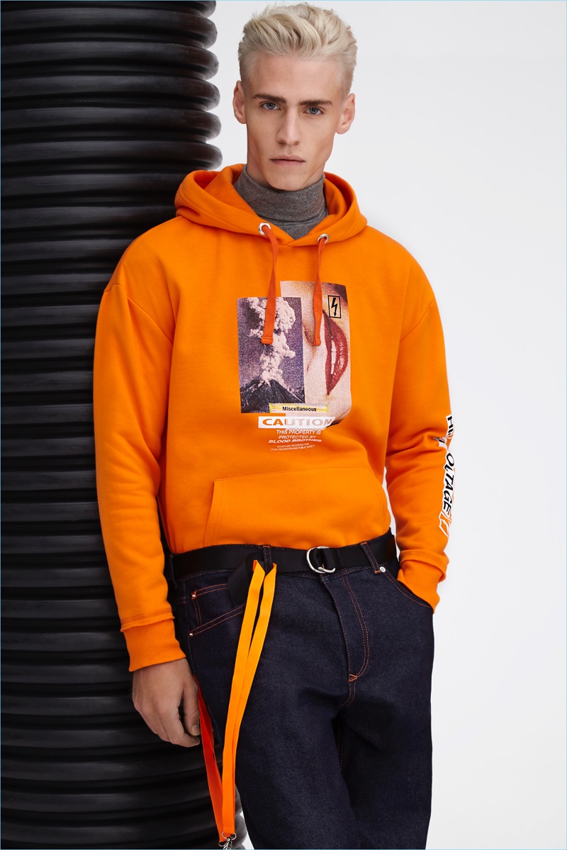 Blood Brother embraces a pop of color with orange pieces like this graphic hoodie.