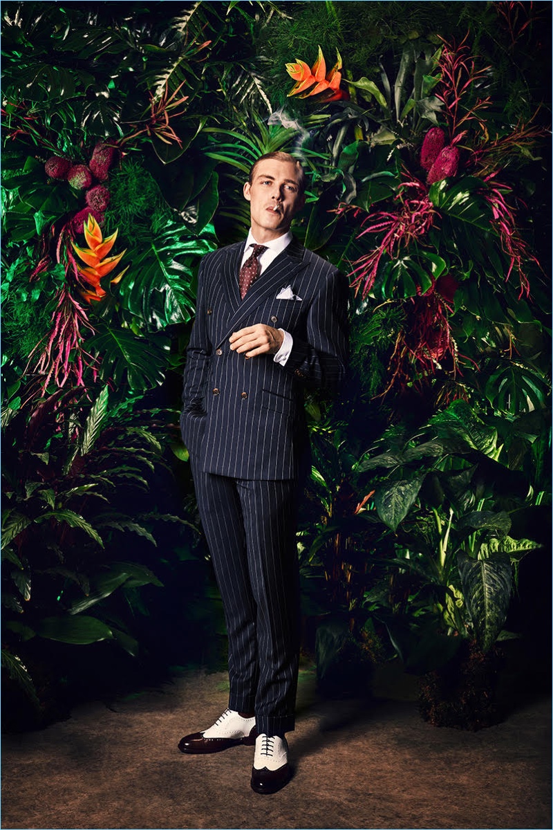 Donning a pinstripe suit, David Schütter appears in Rooks & Rocks' spring-summer 2018 lookbook.