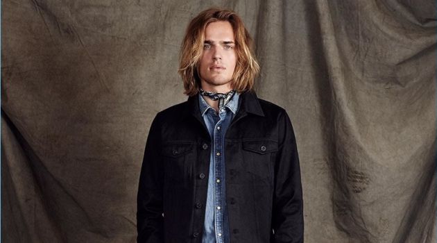 Japan to the 'Dam: Ton Heukels Sports Scotch & Soda's Pre-Spring '18 Looks Scotch & Soda proposes elevated double denim with its Amsterdams Blauw label. Here, Ton Heukels wears a black denim trucker jacket with a light wash denims shirt. Cropped trousers polish up the timeless look.