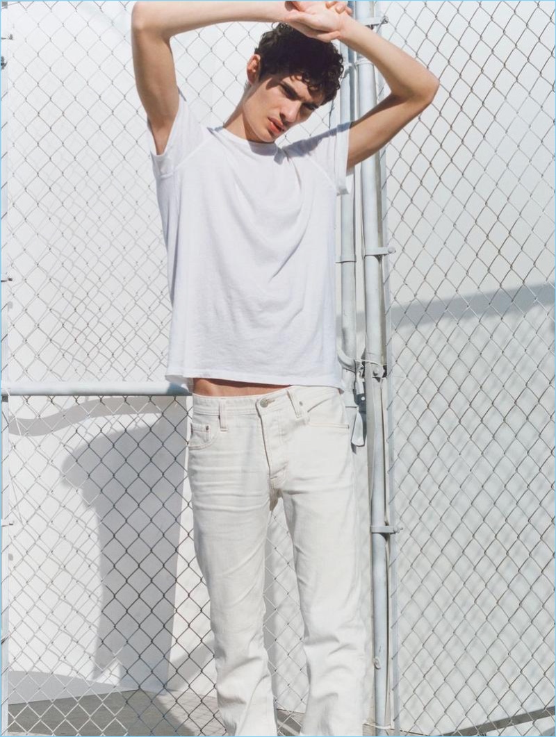 Piero Mendez rocks white denim for AG Jeans' spring-summer 2018 campaign.