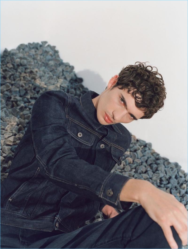 Sporting blue denim, Piero Mendez fronts AG Jeans' spring-summer 2018 campaign.