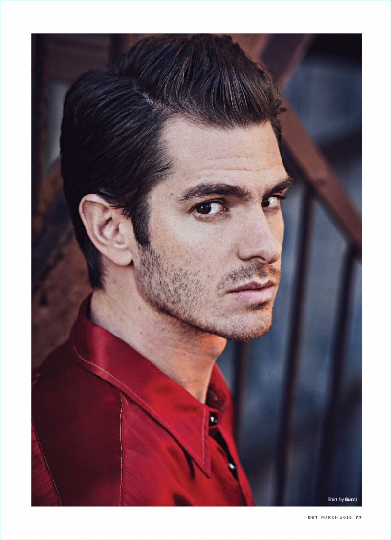 Actor Andrew Garfield wears a red shirt by Gucci.
