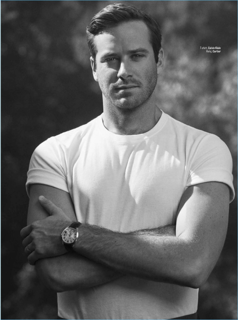 Embracing casual style, Armie Hammer wears a Calvin Klein t-shirt and Cartier watch.