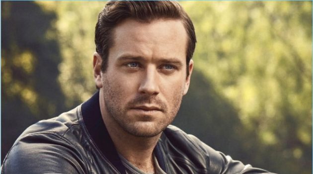 Starring in a new photo shoot, Armie Hammer wears a Dolce & Gabbana bomber jacket. He also rocks a H&M henley, Chopard watch, and Louis Vuitton pants.