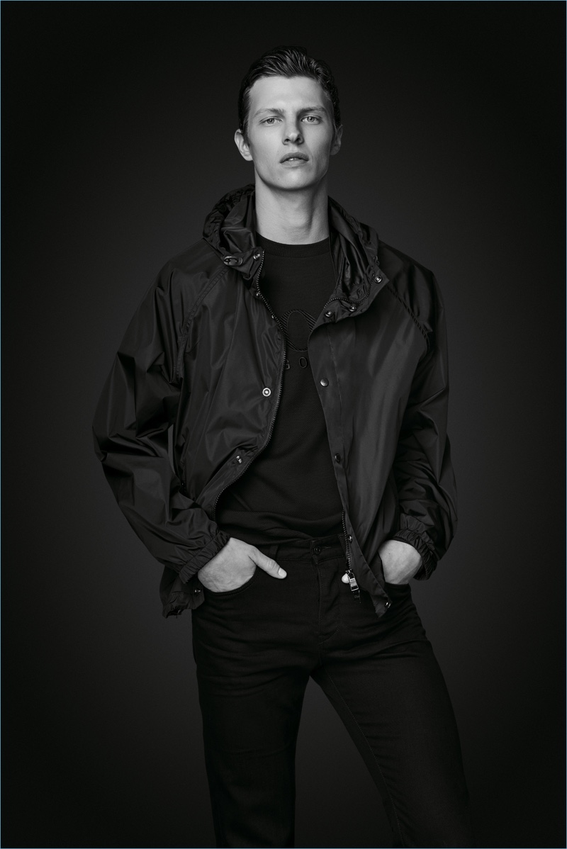 Tim Schuhmacher wears a windbreaker and jeans from BOSS' Black Edition capsule collection. » BOSS Revisits Modern Wardrobe with Black Edition Capsule Tim Schuhmacher wears a windbreaker and jeans from BOSS' Black Edition capsule collection.