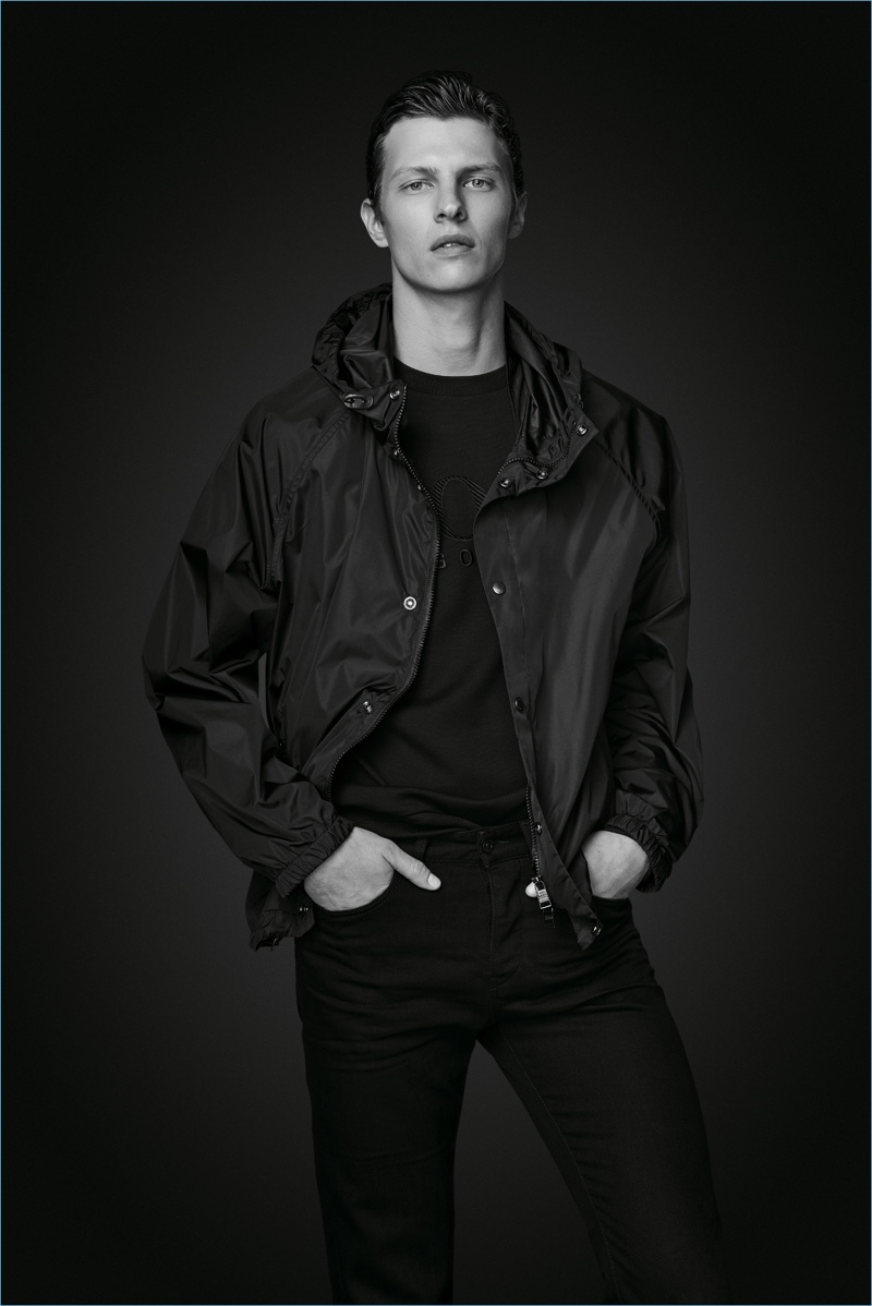 Tim Schuhmacher wears a windbreaker and jeans from BOSS' Black Edition capsule collection.