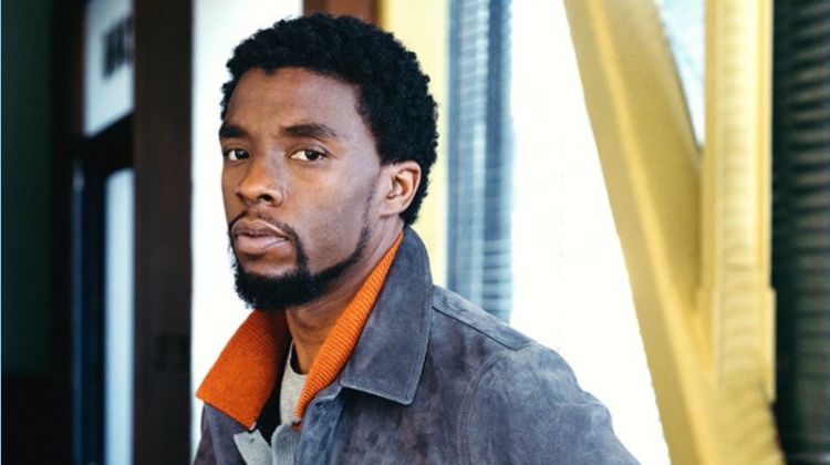 A smart vision, Chadwick Boseman wears a Berluti suede jacket, Saint Laurent t-shirt, and Gucci jeans. The Black Panther actor also rocks a striped knit from The Elder Statesman.