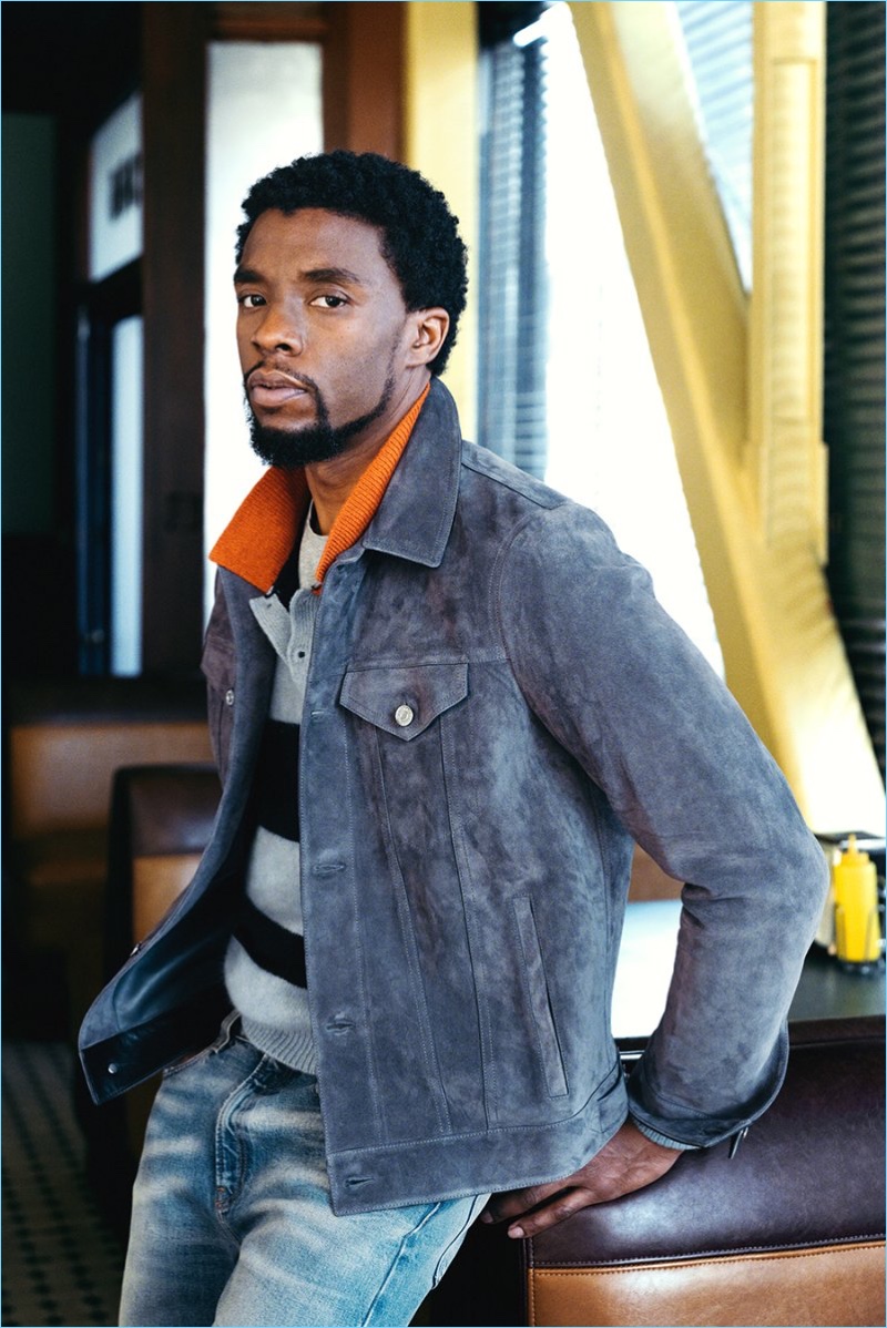 A smart vision, Chadwick Boseman wears a Berluti suede jacket, Saint Laurent t-shirt, and Gucci jeans. The Black Panther actor also rocks a striped knit from The Elder Statesman.