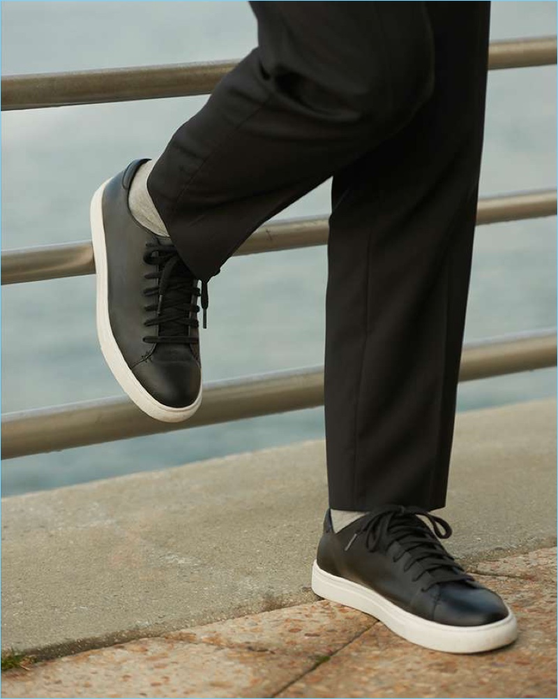 Dress down Club Monaco's wool trousers with its black leather sneakers.