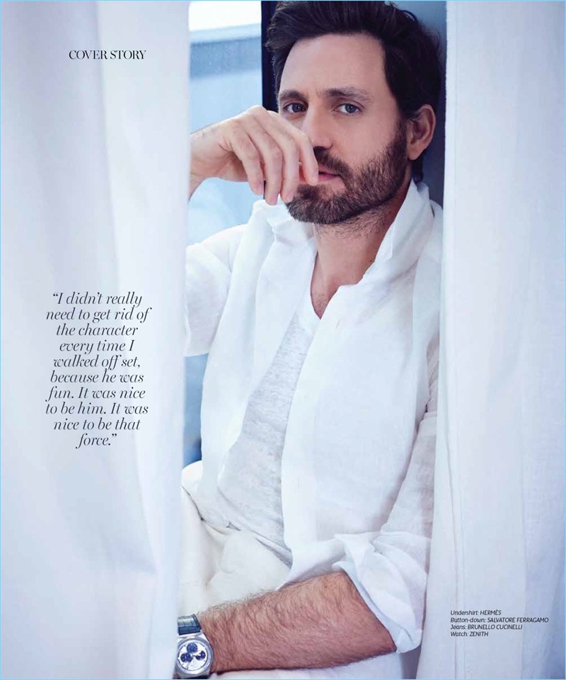 Dressed in white, Edgar Ramirez wears a Hermès undershirt, Salvatore Ferragamo shirt, and Brunello Cucinelli jeans. He also dons a Zenith watch.