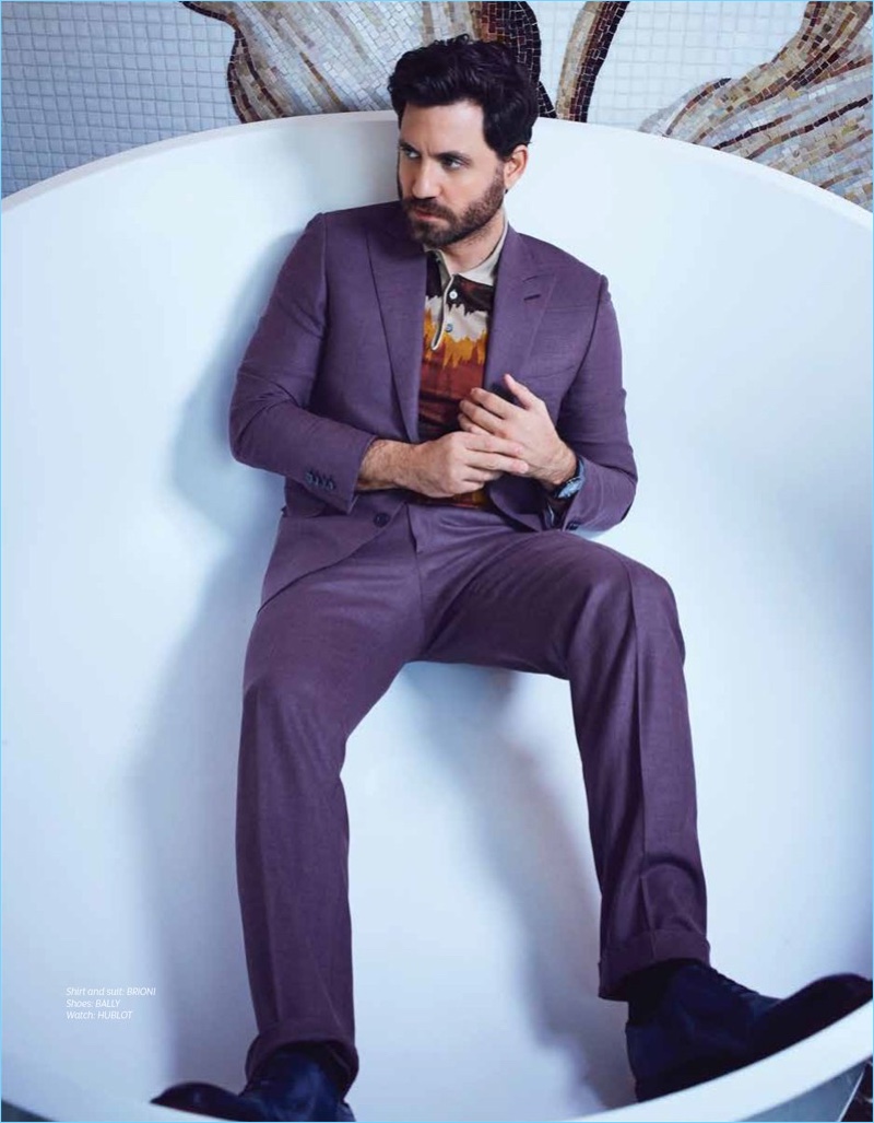 A sleek vision, Edgar Ramirez wears a shirt and suit by Brioni. Bally shoes and a Hublot watch complete his look.