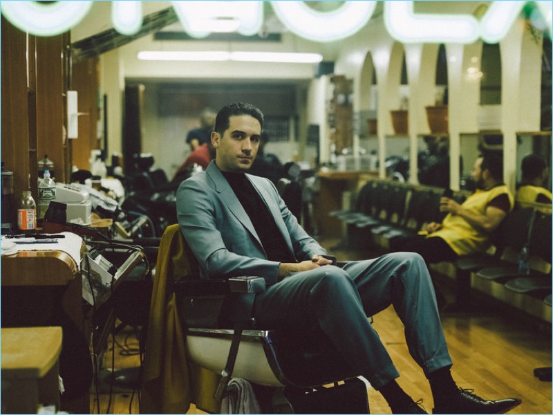 Taking to the barber shop, G-Eazy wears an Ermenegildo Zegna Couture suit with a Hermès top.