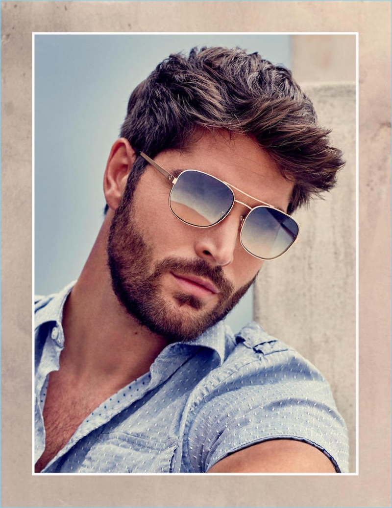 A cool vision in sunglasses, Nick Bateman stars in Guess' spring-summer 2018 accessories campaign.