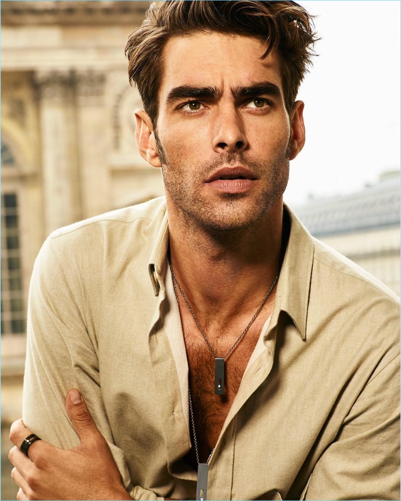 Jon Kortajarena wears Messika's Move Titanium Anthracite and Natural pendants with a Move Titanium Anthracite ring.