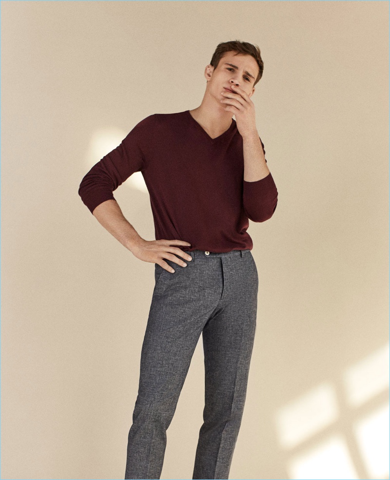 A smart vision, Julian Schneyder wears a Massimo Dutti v-neck sweater and trousers.