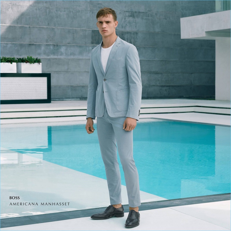 Julian Schneyder wears a BOSS suit.