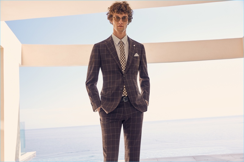 Donning a windowpane print suit, Marçal Taberner is dapper in Luigi Bianchi Mantova.