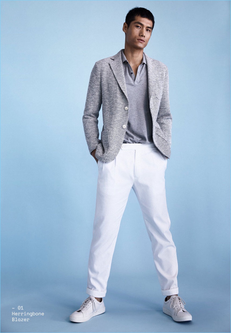 Hao Yun Xiang is a spring vision in a herringbone blazer and white pants from Massimo Dutti.