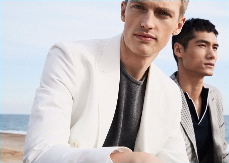 Models Victor Nylander and Hao Yun Xiang star in an editorial for Massimo Dutti.