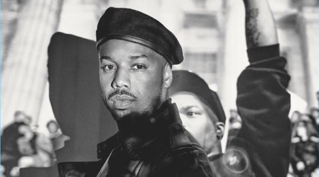 Michael B. Jordan Covers British GQ, Discusses Importance of 'Black Panther' Starring in a photo shoot, Michael B. Jordan sports a leather Burberry coat with a John Smedley turtleneck. He also wears a Lock & Co. beret.