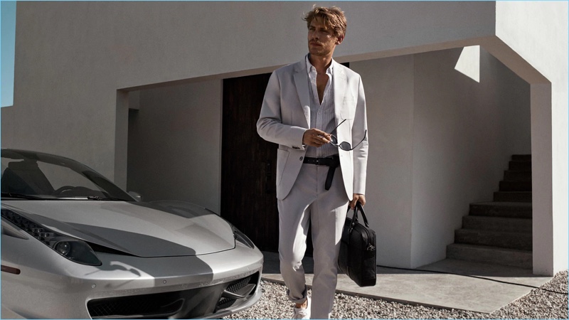 Connecting with Michael Kors for spring-summer 2018, Baptiste Radufe dons a light colored suit.