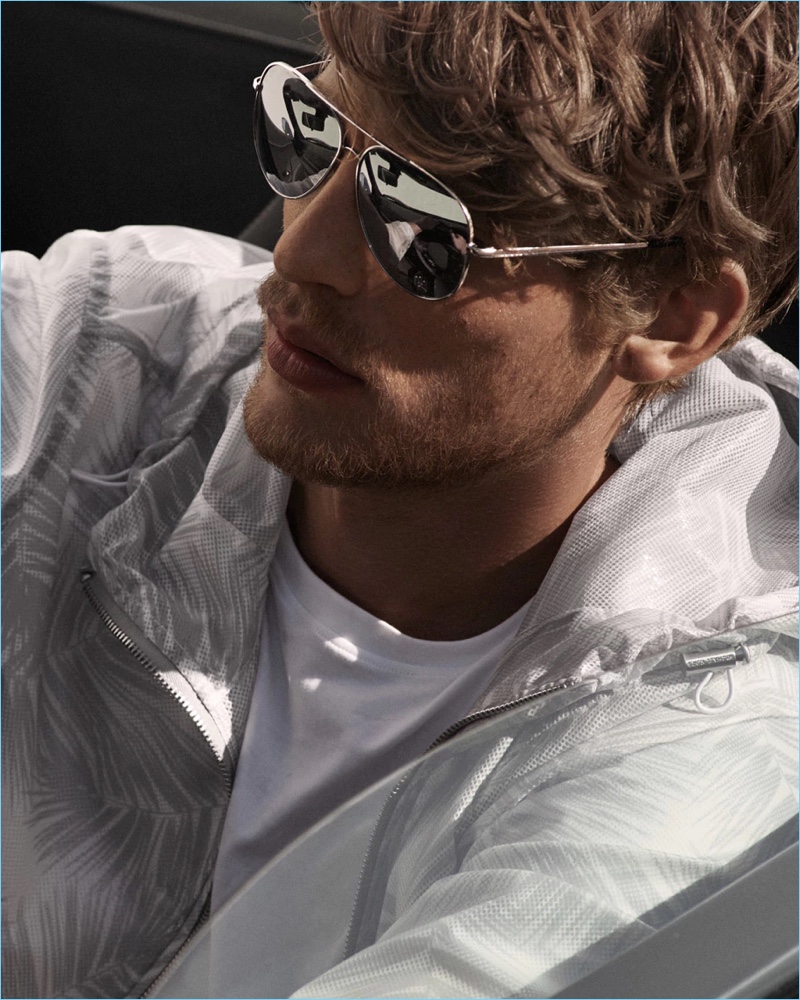 A sporty vision, Baptiste Radufe dons sunglasses by Michael Kors.