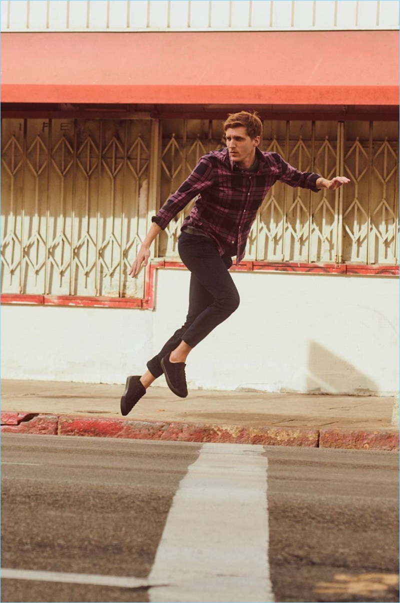 Taking to the streets, Nathan Mitchell wears a plaid shirt from H&M.