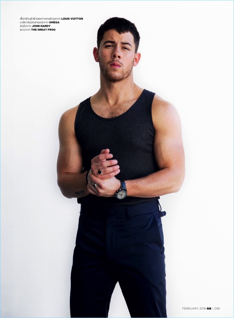 Sporting a form-fitting look, Nick Jonas wears Louis Vuitton.