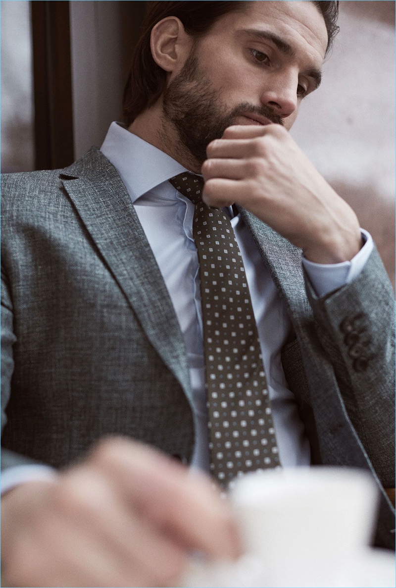 Embracing a sartorial flair, Jamie Jewitt dons a Reiss blazer, shirt, and tie.