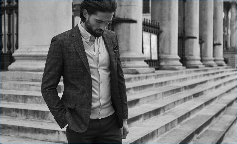 Reiss proposes a fresh alternative to the traditional suit look with a blazer and cardigan. Here, Jamie Jewitt wears it with a shirt and paisley print pocket square.