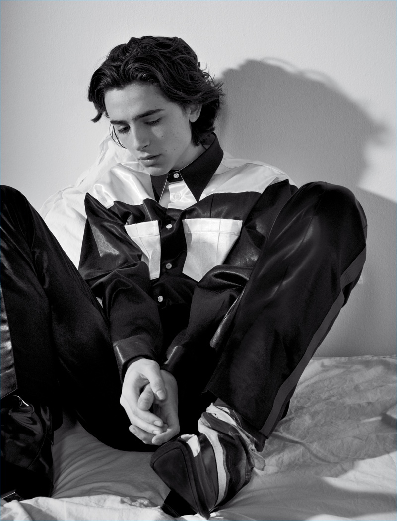 Sitting for a moody image, Timothée Chalamet wears Calvin Klein.