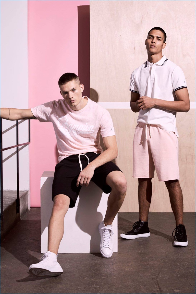 Left to Right: William Los wears a Todd Snyder x Champion graphic t-shirt and sweatshorts. Geron McKinley models a tipped pique polo and sweatshorts.