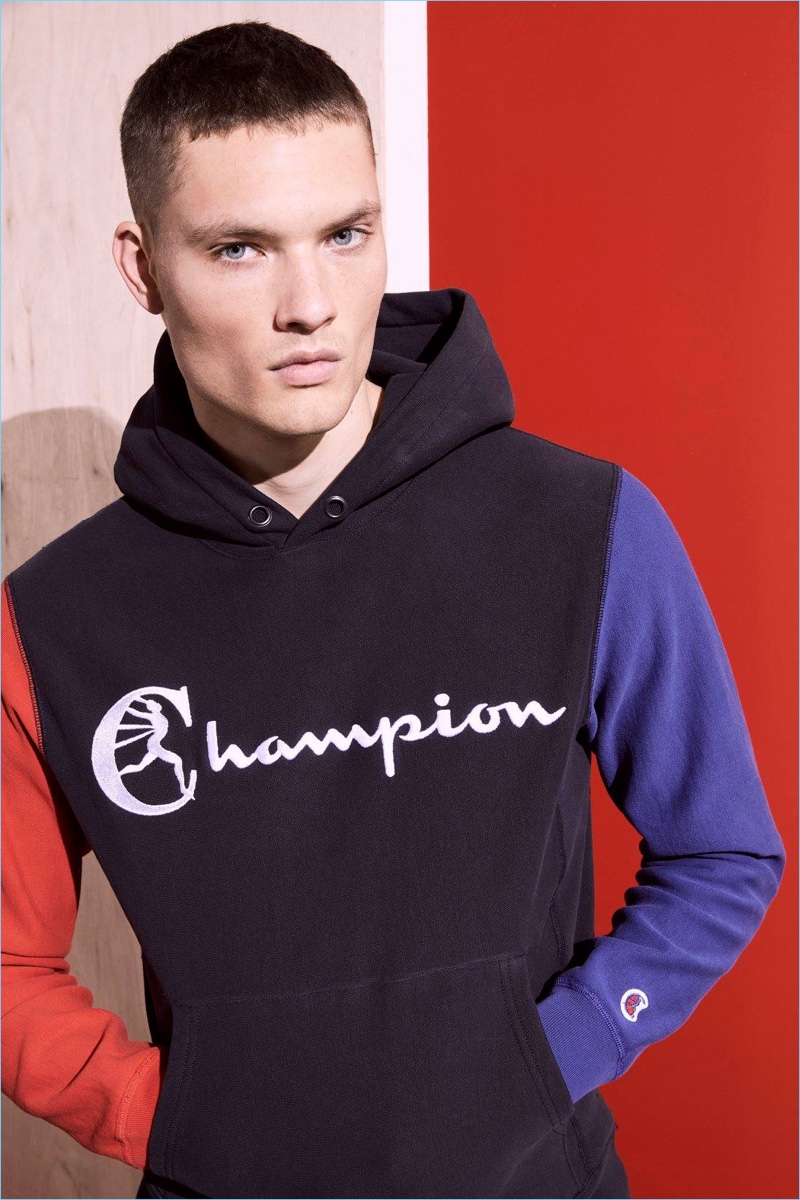 William Los sports a color-blocked hoodie from Todd Snyder's Champion collaboration.