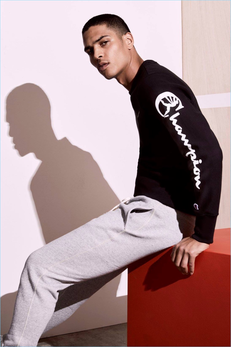 Geron McKinley sports a graphic sleeve sweatshirt and sweatpants from Todd Snyder's Champion collaboration.