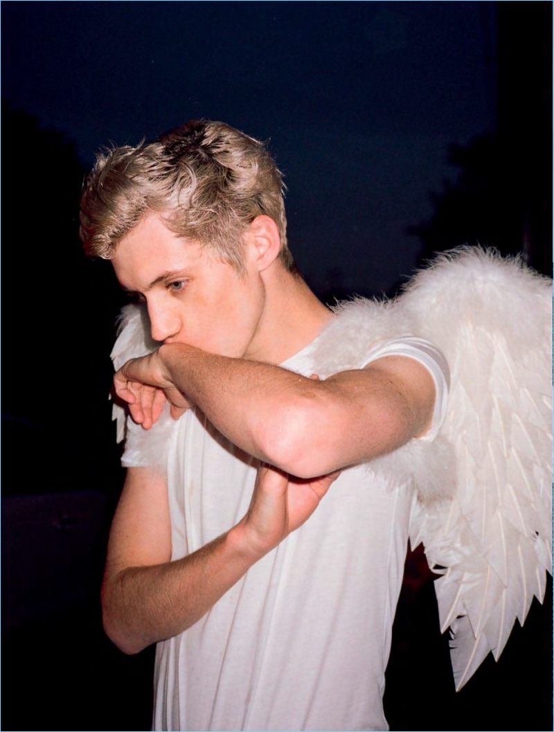 Pierre-Ange Carlotti photographs Troye Sivan with angel wings for Dazed magazine.