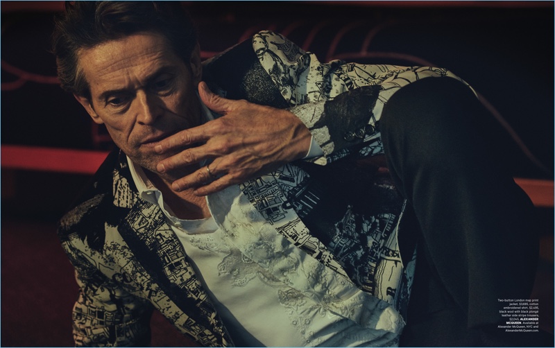 Connecting with Essential Homme, Willem Dafoe sports a dapper look from Alexander McQueen.