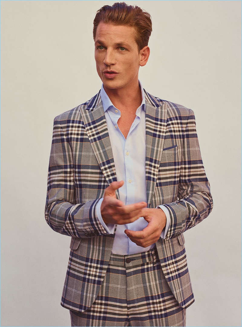 Embracing checks, Hugo Sauzay dons suiting from Zara Man.