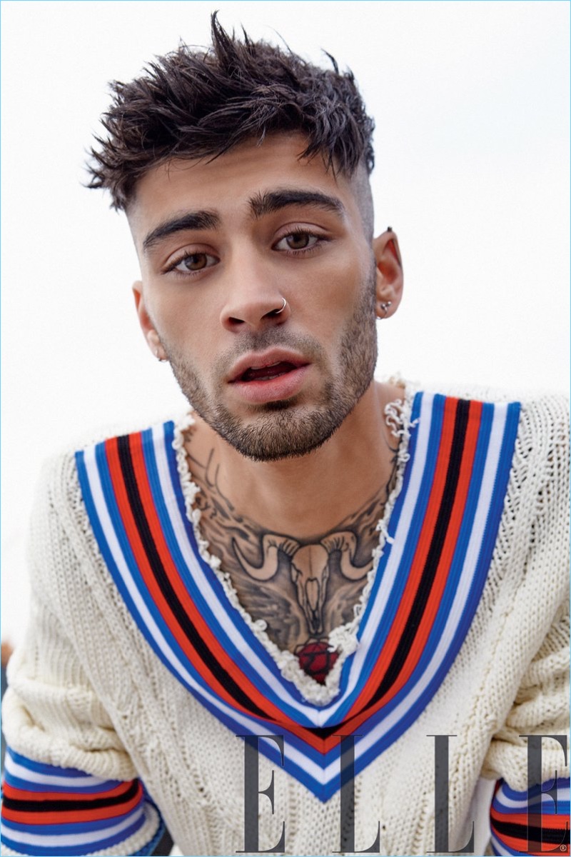 Going preppy, Zayn Malik wears a Hilfiger Collection v-neck sweater.