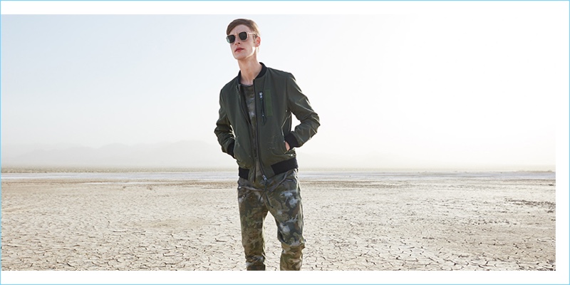 Making a military-inspired style statement, Roberto Sipos rocks a Tigha bomber jacket and Selected sunglasses.