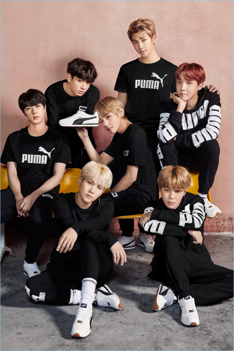 Korean pop group BTS pose with Puma sneakers.