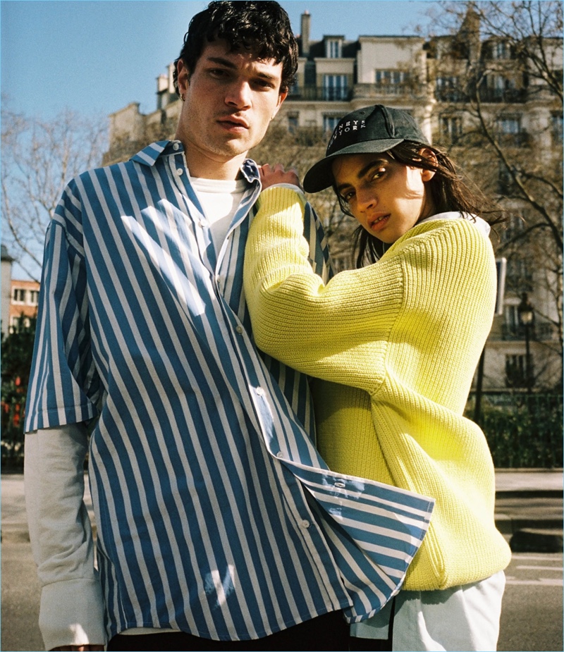 Layering, Luka Isaac wears an Off-White long-sleeve tee with a Martine Rose striped shirt.