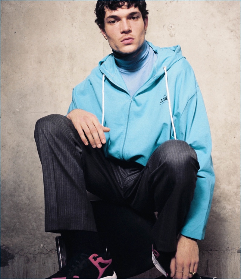 Model Luka Isaac sports a Balenciaga hoodie, Calvin Klein t-shirt, and Gosha Rubchinskiy trousers.