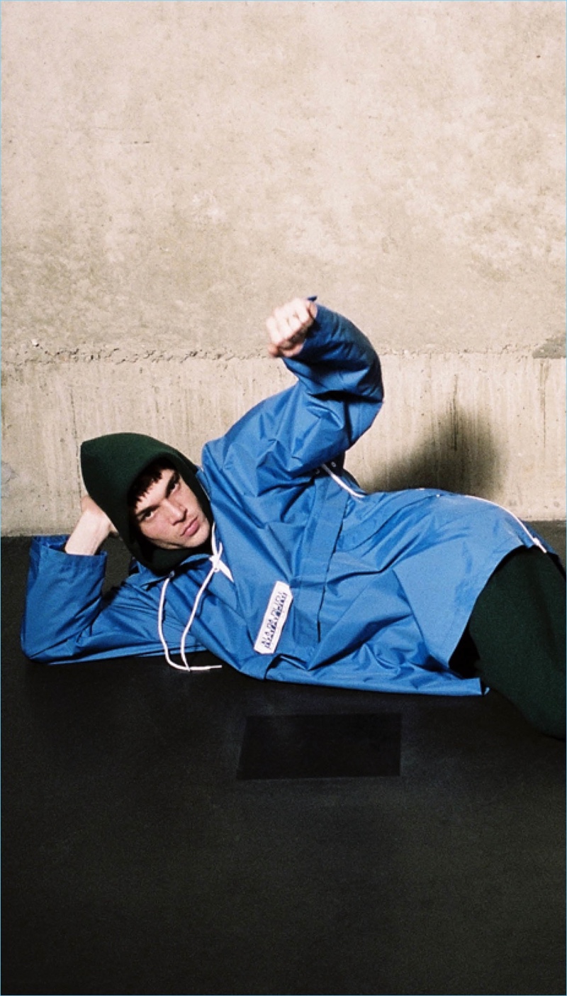 Posing for the camera, Luka Isaac models a Napa by Martine Rose anorak with a hoodie and sweatpants by Alexander Wang.